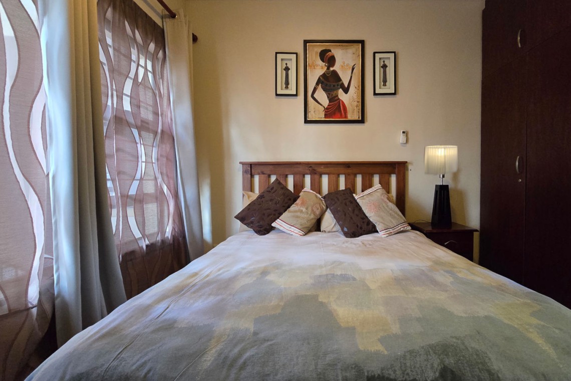 The comfortable 2nd bedroom at Topanga 25, a beachfront holiday rental in Uvongo perfect for families seeking affordable holiday accommodation in Uvongo.