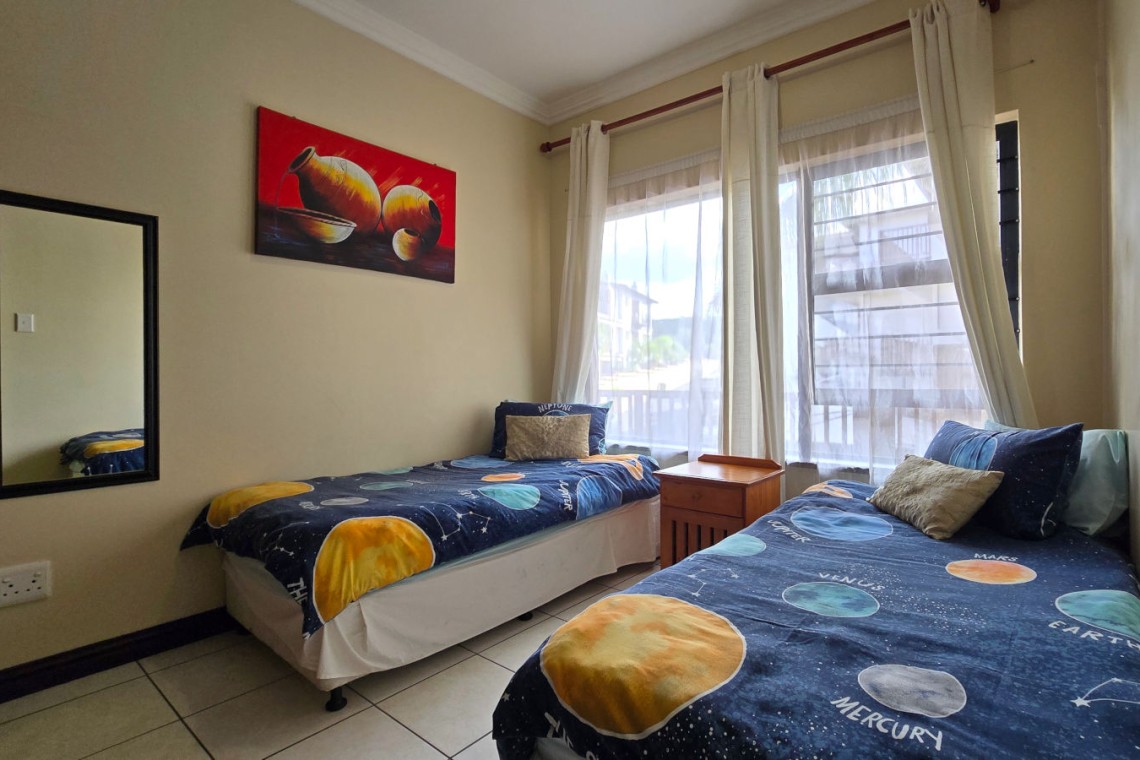 The comfortable 3rd bedroom at Topanga 25, a beachfront holiday rental in Uvongo perfect for families seeking affordable holiday accommodation in Uvongo.
