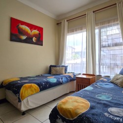 The comfortable 3rd bedroom at Topanga 25, a beachfront holiday rental in Uvongo perfect for families seeking affordable holiday accommodation in Uvongo.