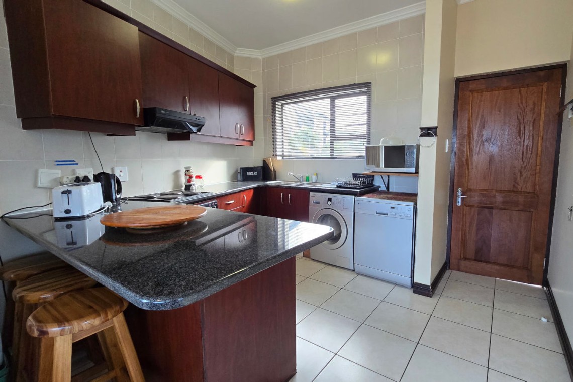 Fully equipped kitchen at Topanga 25, a sea facing 6 sleeper in Uvongo ideal for self-catering guests wanting a beachfront holiday rental in Uvongo.