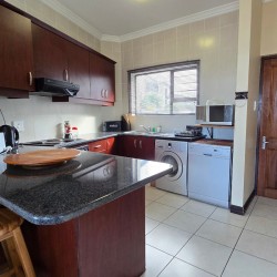 Fully equipped kitchen at Topanga 25, a sea facing 6 sleeper in Uvongo ideal for self-catering guests wanting a beachfront holiday rental in Uvongo.