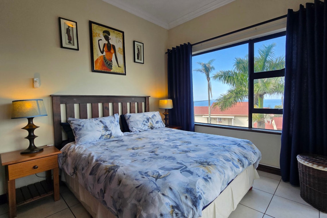 Comfortable main bedroom at Topanga 25 with a sea view, a beachfront holiday rental in Uvongo perfect for families seeking affordable holiday accommodation in Uvongo.