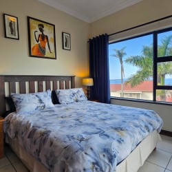Comfortable main bedroom at Topanga 25 with a sea view, a beachfront holiday rental in Uvongo perfect for families seeking affordable holiday accommodation in Uvongo.