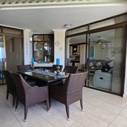 The dining area on the enclosed patio at Chardonnay Cabanas 5