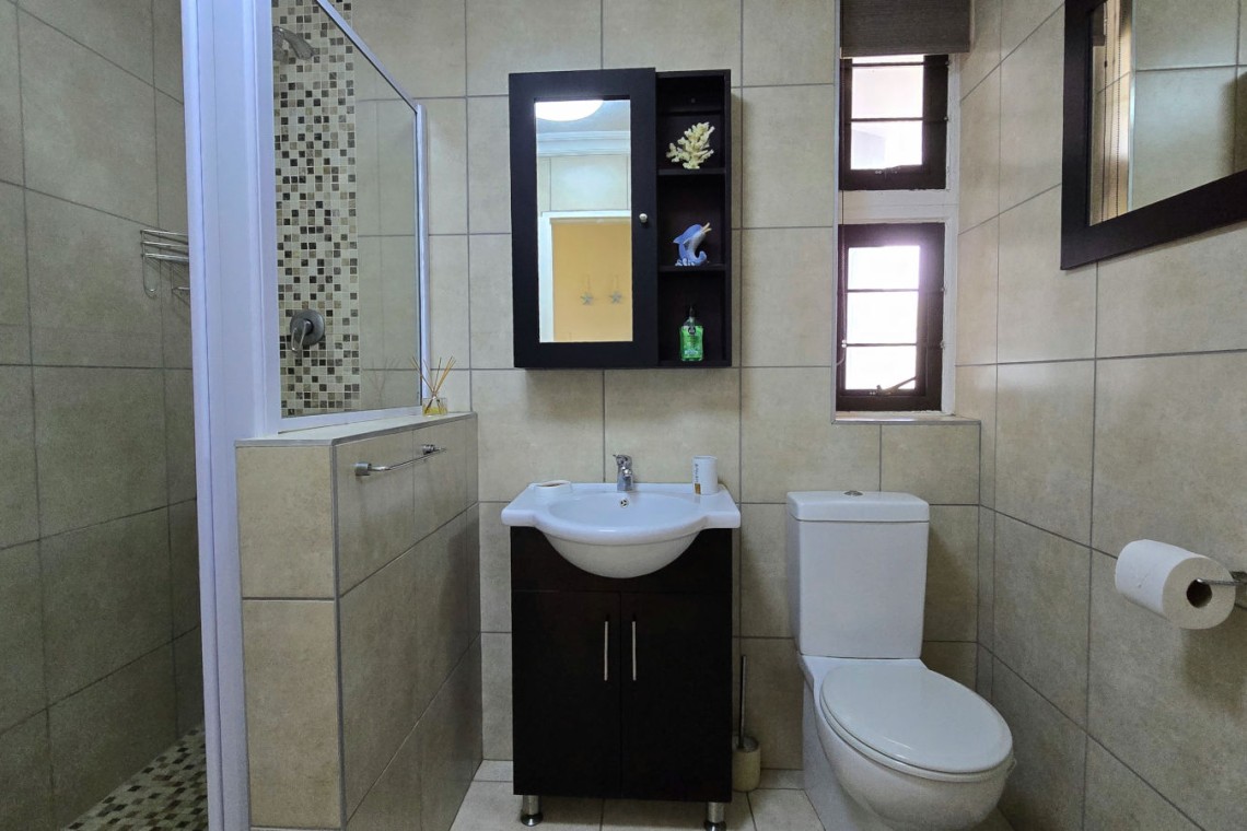 Second bathroom at Chardonnay Cabanas 5 with shower and toilet