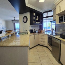 Kitchen at Chardonnay Cabanas 5 with fridge, dishwasher, washing machine and tumble dryer