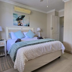 Queen bedroom at Chardonnay Cabanas 5 with air‑conditioning and ceiling fan