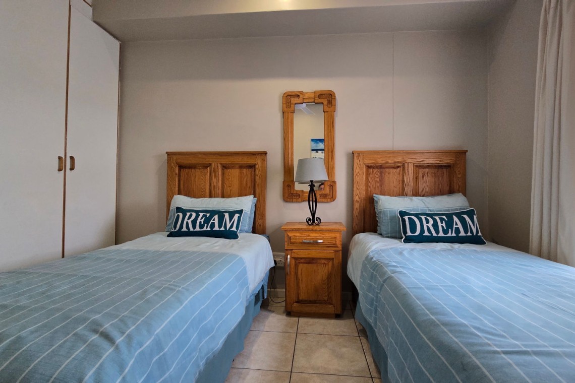 The 2nd bedroom at Portofino 15 in Shelly Beach is perfect for the kids with two single beds.