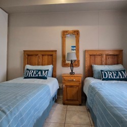 The 2nd bedroom at Portofino 15 in Shelly Beach is perfect for the kids with two single beds.