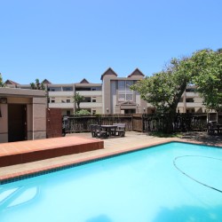 Secure swimming pool and braai area at Portofino 15 in Shelly Beach