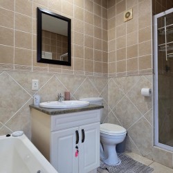 The fully fitted en-suite bathroom off the main bedroom at Portofino 15.