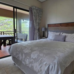 Second bedroom with a queen-sized bed at Portofino 15 in Shelly Beach