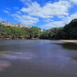 Calm lagoon with sandy beach near Chardonnay Cabanas 5 on Uvongo Beach